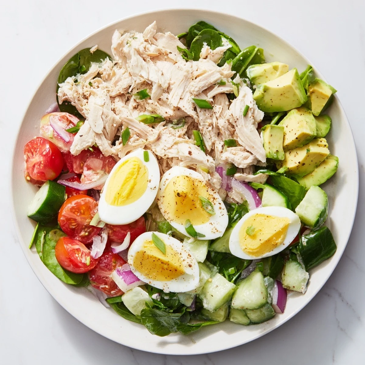 This healthy High-Protein Chicken and Egg Salad features vibrant colors, perfect for lunch.