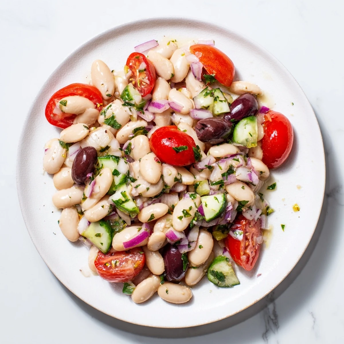 This delicious white bean salad showcases creamy beans and a bright, zesty olive oil dressing.