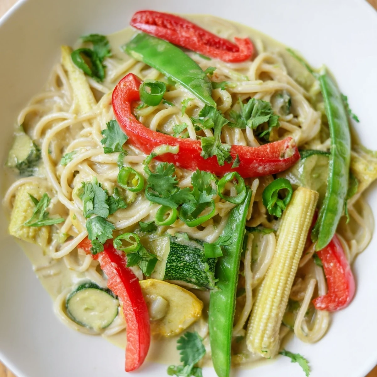 Creamy Thai Curry Pasta with colorful vegetables, offering a delightful coconut and spice aroma.