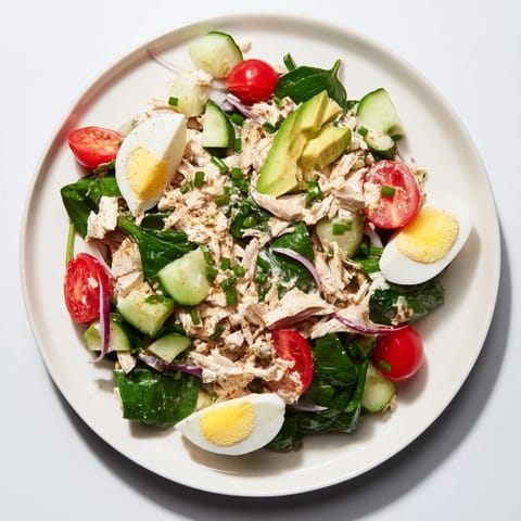 Juicy shredded chicken and egg salad combine with fresh veggies and tangy dressing perfectly.