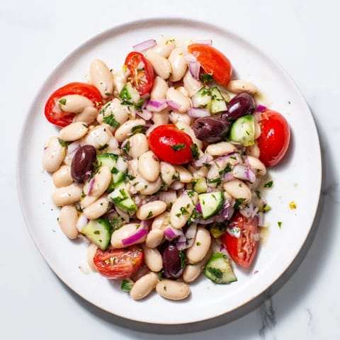 This delicious white bean salad showcases creamy beans and a bright, zesty olive oil dressing.