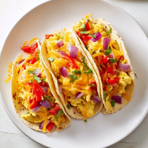 Freshly baked Sheet Pan Breakfast Tacos with savory eggs and colorful bell peppers, a quick morning feast.